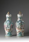 A pair of large Chinese famille rose baluster vases and covers