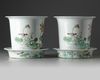 A pair of Chinese famille rose jardinières and stands
