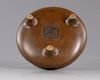 A Chinese bronze tripod censer