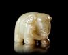 A PALE CELADON JADE ELEPHANT, CHINA, HAN DYNASTY (206 BC–220 AD)