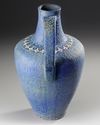 A MONUMENTAL TURQUOISE-BLUE GLAZED POTTERY JUG, SPAIN, CIRCA 15TH-16TH CENTURY
