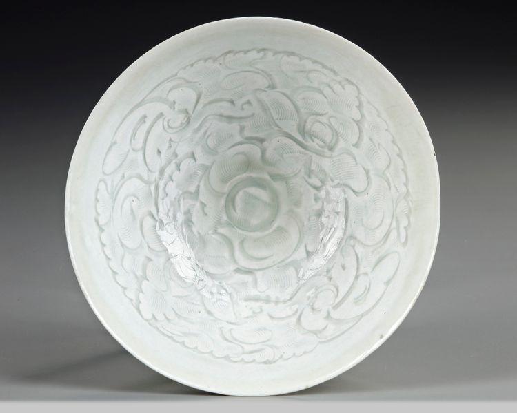 A FINELY CARVED QINGBAI 'BOYS' CONICAL BOWL, SONG DYNASTY (960–1279)