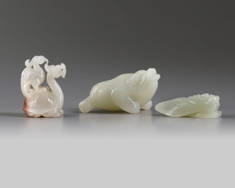 A GROUP OF CHINESE WHITE AND PALE CELADON JADE MYTHICAL BEAST CARVINGS, 20TH CENTURY