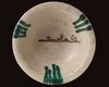 AN ABBASID TIN GLAZED POTTERY BOWL, MESOPOTAMIA, 9TH CENTURY