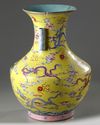 A Chinese yellow-ground famille rose 'nine dragon' vase, hu