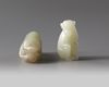 TWO CHINESE CELADON AND PALE CELADON JADE MONKEYS, 20TH CENTURY