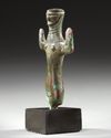 AN ELAMITE BRONZE FEMALE FIGURE, CIRCA 2ND MILLENNIUM B.C.