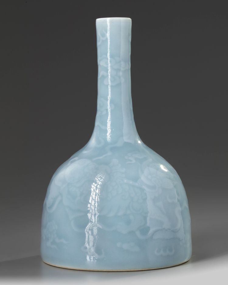 A Chinese pale blue-glazed 'Buddhist lions' mallet vase