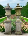 A PAIR OF CLASSISC CONTINENTAL SCULPTED PIER GATE FINIALS, 20TH CENTURY