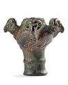 A BRONZE MACE HEAD WITH FOUR RECLINING RAMS, LURISTAN, 10TH-8TH CENTURY BC