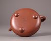 A Chinese yixing tripod teapot and cover