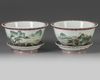 A pair of Chinese famille rose jardinieres and stands