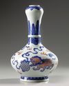 A Chinese copper-red-decorated blue and white garlic-head vase