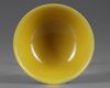 A CHINESE YELLOW-GROUND GREEN-ENAMELLED DRAGON' BOWL, QIANLONG SEAL MARK IN UNDERGLAZE BLUE AND OF THE PERIOD 1736-1795