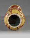 A CHINESE IRON-RED AND YELLOW-ENAMELLED 'DRAGON' BRUSH HANDLE, QING DYNASTY (1644-1911)