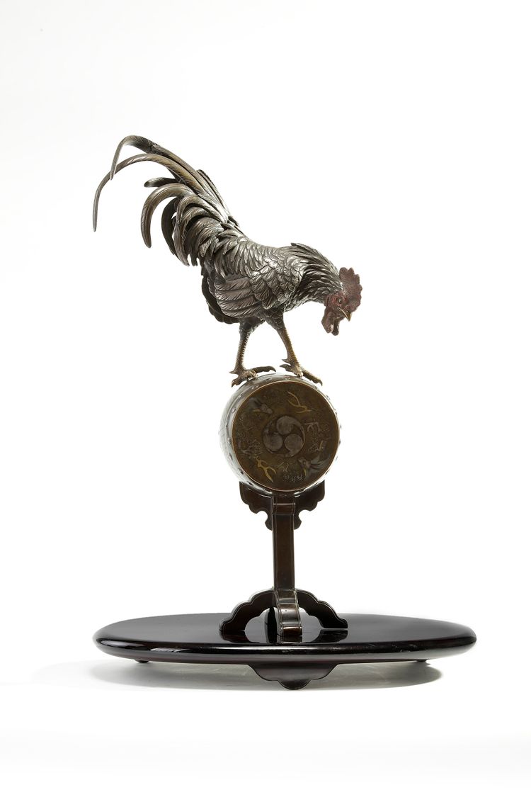 A Japanese figure of a rooster on a stand