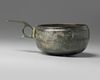A bronze Seljuq cup with handle