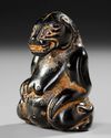 A CARVED HARDWOOD BEAR, CHINA, HAN DYNASTY (206 BC– 220 AD)