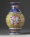 A Chinese famille rose 'Eighteen Luohan' revolving vase