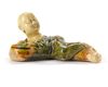 A CHINESE SANCAI CERAMIC BRUSH REST IN THE FORM OF A RECUMBENT BOY, SONG DYNASTY (960-1279)