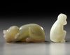 TWO CHINESE CELADON AND PALE CELADON JADE MONKEYS, 20TH CENTURY