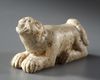 A WESTERN ASIATIC ELAMITE AMULET LIMESTONE WITH LION SEATED, CIRCA 2ND-1ST MILLENNIUM  B.C.