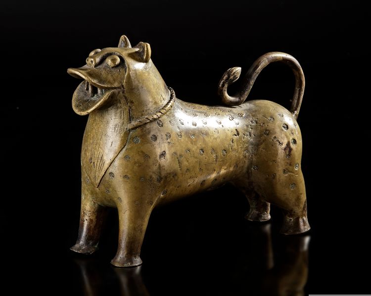 A MUGHAL BRASS INCENSE BURNER IN THE FORM OF A LION, INDIA, 17TH CENTURY