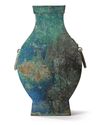 A CHINESE BRONZE SQUARE-SECTION TWIN-HANDLED HU VASE, HAN DYNASTY (206 BC-220AD)