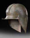 A GREEK BRONZE ILLYRIAN HELMET, CIRCA 6TH-5TH CENTURY B.C.
