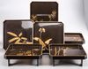A original set of six lacquered trays in their original box
