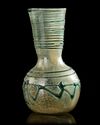 A ROMAN LIGHT GREEN GLASS VASE, 1ST CENTURY AD