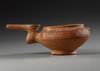 AN AMLASH TERRACOTTA PAINTED SPOUTED VESSEL, CIRCA EARLY 1ST MILLENNIUM B.C.