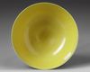 A Chinese yellow and green-enamelled 'bat' bowl with polychrome details