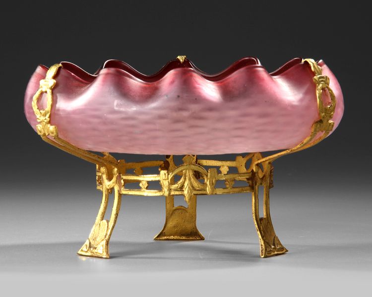 A FRENCH ART NOUVEAU CRANBERRY MAT GLASS BOWL ON A GOLD PLATED BRONZE FOOT, CIRCA 1880-1890