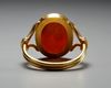 A RENAISSANCE CARNELIAN INTAGLIO PORTRAIT OF THE EMPEROR HADRIAN IN A MODERN GOLD RING, CIRCA 17TH CENTURY A.D.