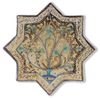 A STAR-SHAPED KASHAN TILE, PERSIA, 13TH-14TH CENTURY