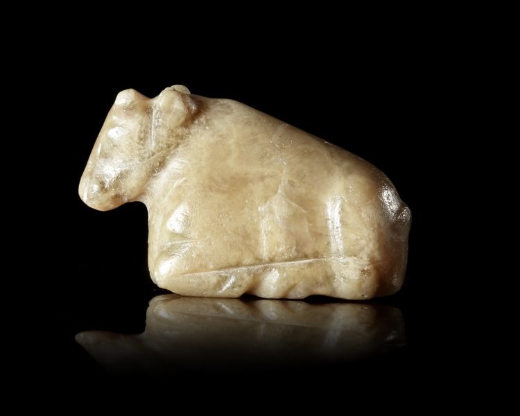 A RECLINING BOVINE IN CRYSTALLINE CALCITE, 2ND-3RD MILLENIUM BC