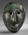 A WESTERN PERSIAN BRONZE MALE MASK, CIRCA 1200-800 B.C.