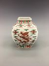 An iron-red-decorated green enamelled 'dragon' jar