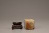 A pale celadon and russet jade cong