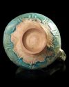 A TURQUOISE GLAZED POTTERY EWER, PROBABLY NISHAPUR, 12TH CENTURY