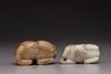 Two jade Buddhist lion carvings