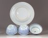 A group of four blue and white objects