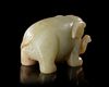 A PALE CELADON JADE ELEPHANT, CHINA, HAN DYNASTY (206 BC–220 AD)