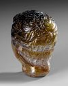 A ROMAN GLASS HEAD VESSEL CIRCA 1ST–3RD CENTURY A.D.