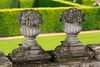 A PAIR OF CARVED LIMESTONE PIER FINIALS IN THE FORM OF FRUITING BASKETS, LATE 19TH OR EARLY 20TH CENTURY