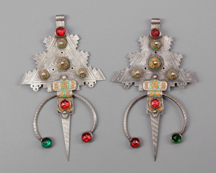 A pair of  mineral inlay fibula's