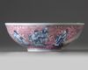 A Chinese puce-enamelled blue and white 'Immortals' bowl