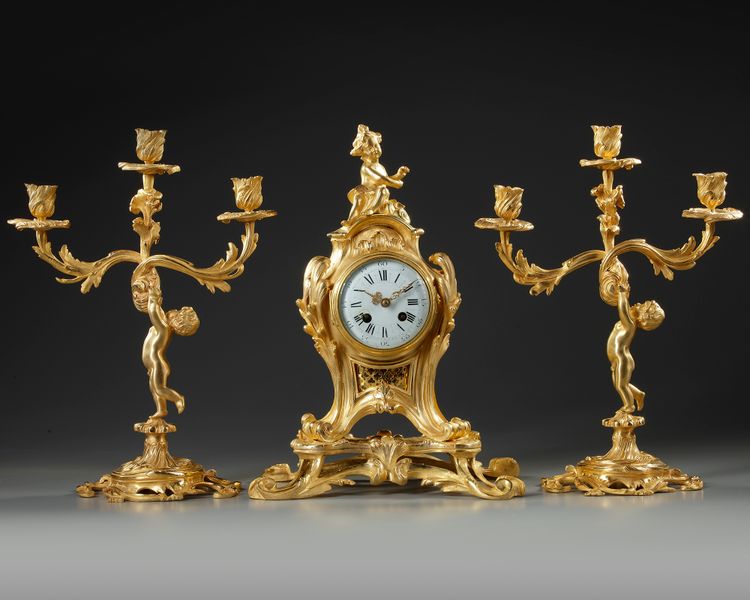 A FRENCH ORMOLU CLOCK SET, LATE 19TH CENTURY