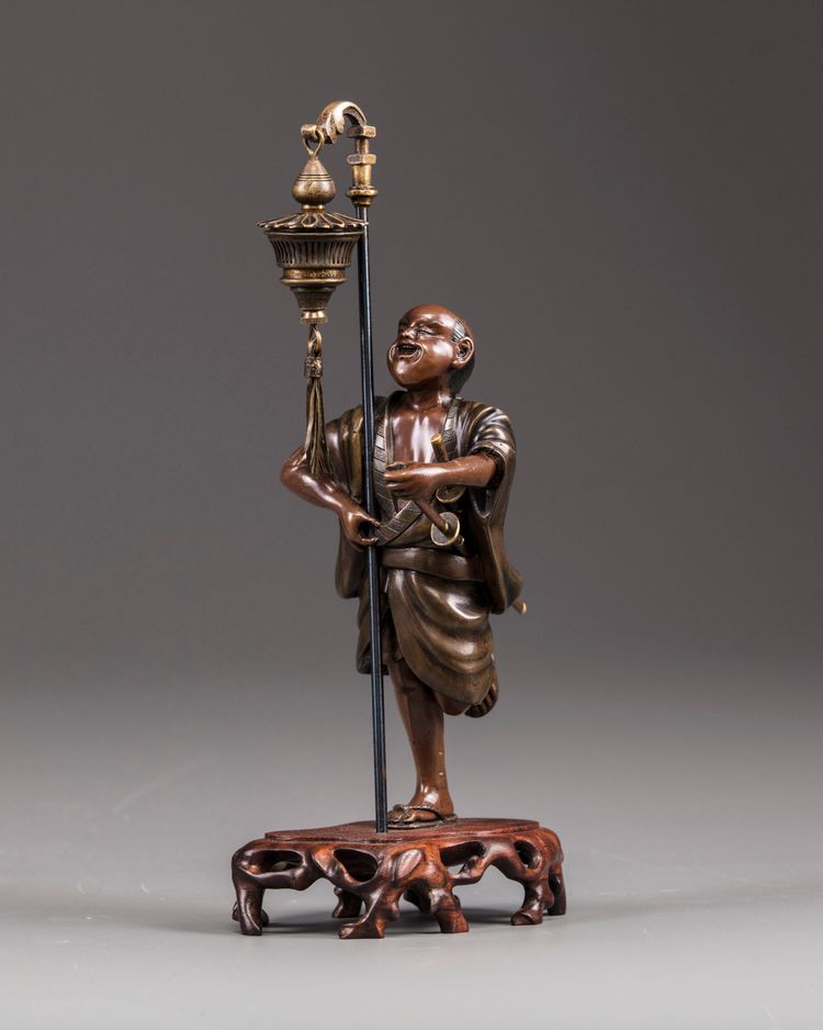 A bronze figure of a samurai